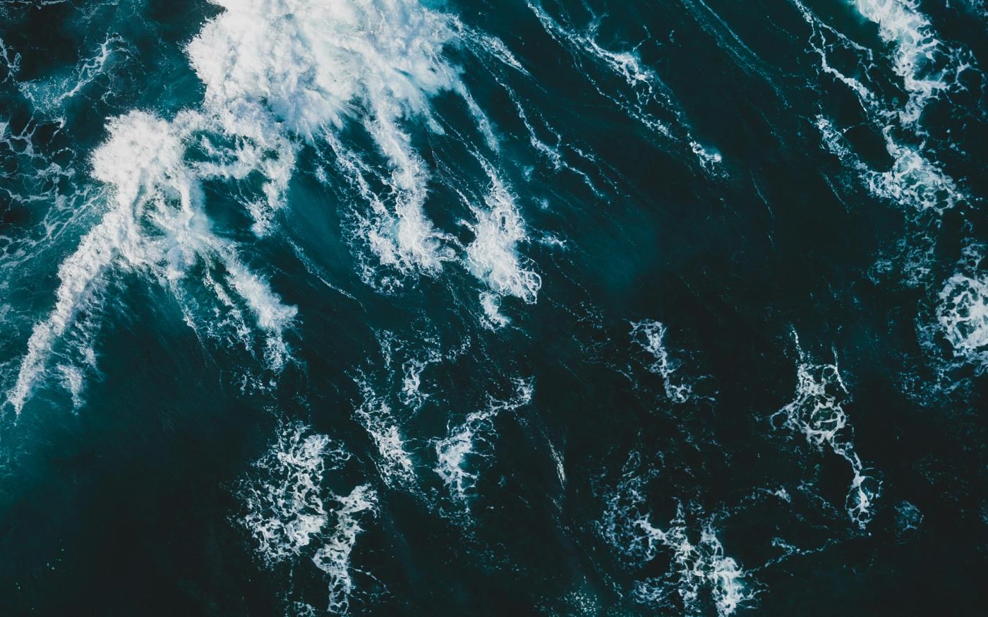 crashing waves by Ivan Bandura courtesy of Unsplash.