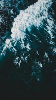 crashing waves by Ivan Bandura courtesy of Unsplash.