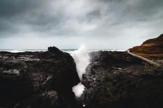 splash body of water on cliff by Pétrin Express courtesy of Unsplash.