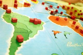 a close up of a board game on a table by Hal Gatewood courtesy of Unsplash.