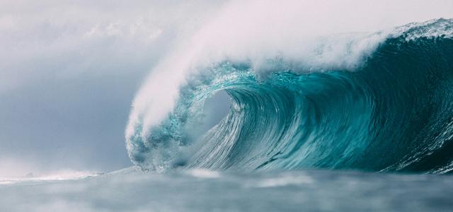 white and blue ocean waves by Matt Paul Catalano courtesy of Unsplash.