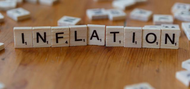 Inflation is spelled out using scrabble tiles. by Markus Winkler courtesy of Unsplash.