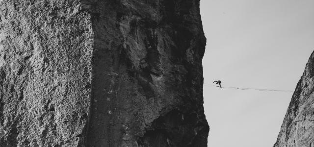 grayscale photo of rock formation by Sean Benesh courtesy of Unsplash.
