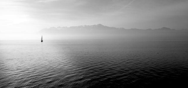 sailboat on calm body of water under white sky at daytime by Hugo Kerr courtesy of Unsplash.