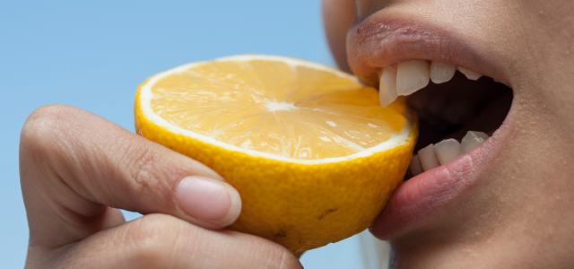 person holding orange fruit during daytime by engin akyurt courtesy of Unsplash.