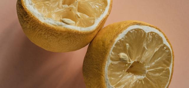 one sliced lemon by Lasse Møller courtesy of Unsplash.